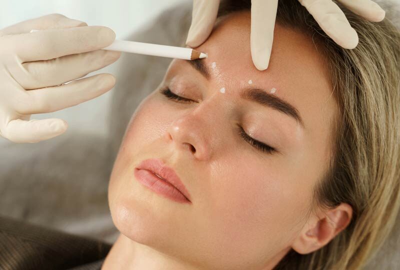 woman getting facial aesthetics injection