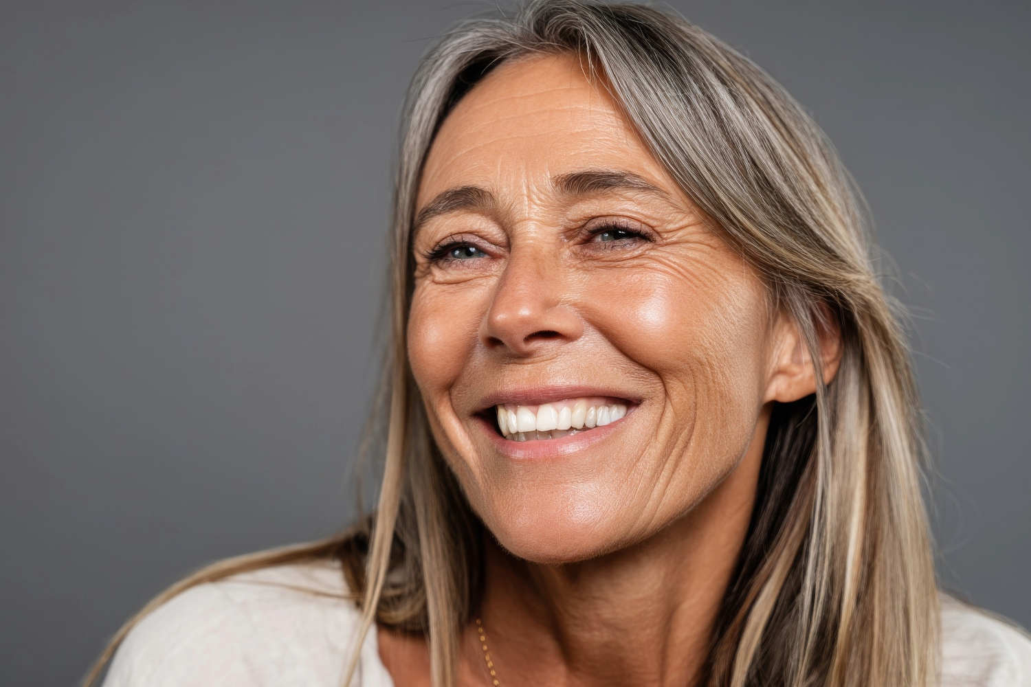 woman with implants smiling